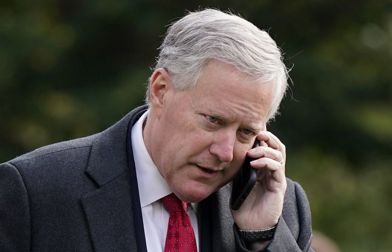 FILE – White House Chief of Staff Mark Meadows speaks on a phone on the South Lawn of the White House in Washington, on Oct. 30, 2020. A revelation about text messages sent by three Fox News personalities to Meadows, former President Donald Trump’s chief of staff, on the day of the Capitol riots raise questions about whether they have lost sight of the â€˜newsâ€™ aspect of their jobs. (AP Photo/Patrick Semansky, File)