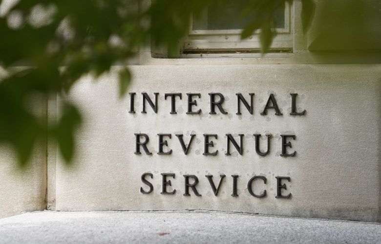 FILE – A sign is displayed outside the Internal Revenue Service building May 4, 2021, in Washington.  (AP Photo/Patrick Semansky, File)