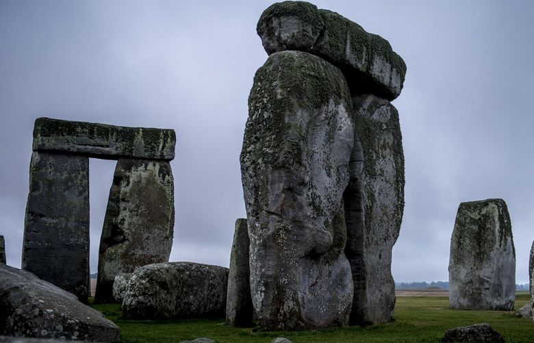 FILE — A section of Stonehenge, a world-famous attraction, near Amesbury, England, Aug. 6, 2014. Rather than following the masses, get the most of world-famous sites through simple beat-the-crowds techniques like considering adventurous alternative routes and setting aside time for complementary sites nearby. (Andrew Testa/The New York Times)