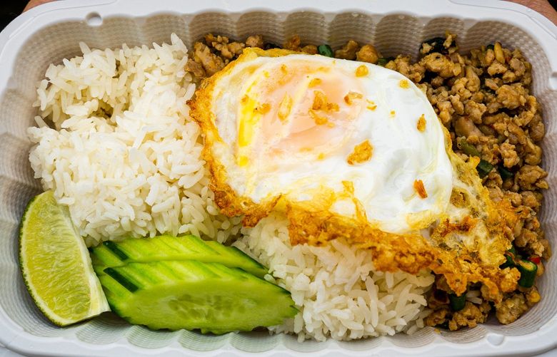 The Pad Ga Prao, served with a steaming pile of jasmine rice and a fried egg, is Tuk Tuk’s most popular menu item.