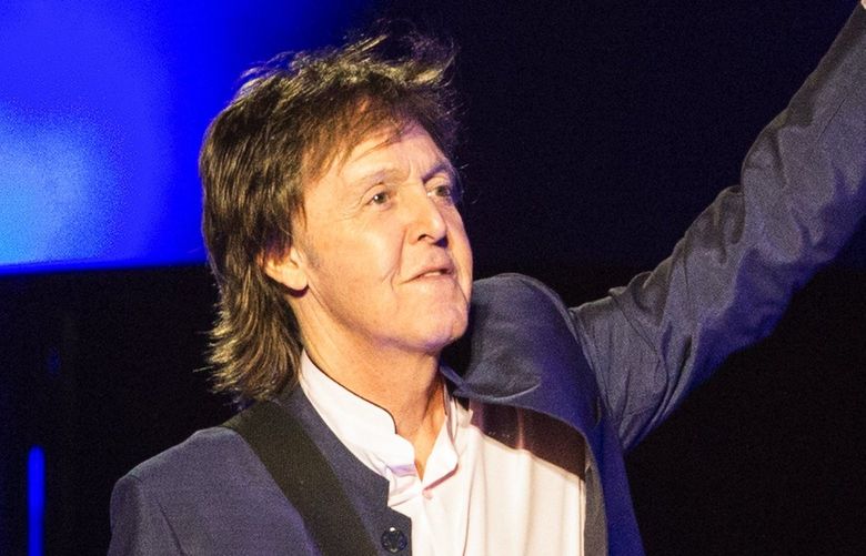 Sir Paul McCartney waves at a cheering crowd as he takes the stage for his “One on One” tour at KeyArena on Sunday, April 17, 2016. McCartney made headlines when he began his tour in Fresno, Calif., performing “A Hard Day’s Night” in concert for the first time in 51 years.