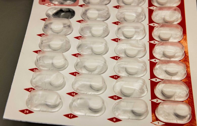 Buprenorphine pills line a sleeve for distribution to inmates at SCORE in Des Moines on Tuesday, Feb. 1, 2022. The jail crushes the pills for inmates who participate in their program.