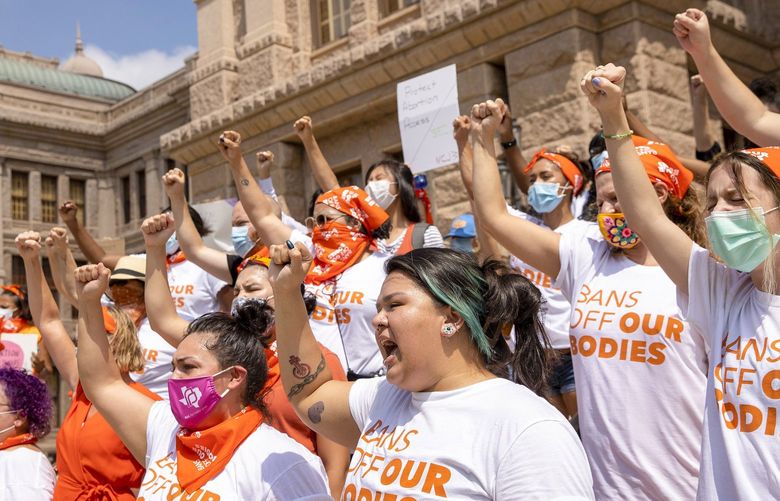 FILE – In this Sept. 1, 2021, file photo, women protest against the six-week abortion ban at the Capitol in Austin, Texas. The Texas abortion ban that so far has outmaneuvered Supreme Court precedent is the latest iteration of a legislative strategy used by Republican-led states to target pornography, gay rights and other hot-button cultural issues. But some are beginning to sound the alarm that the tactic of having enforcement done by citizens instead of government agencies could have a boomerang effect, pointing out that Democrats could use the same strategy on issues like gun control. (Jay Janner/Austin American-Statesman via AP, File) TXAUS601