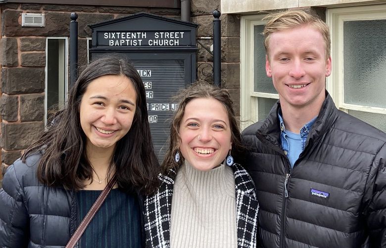 Whitworth University students Kendra Guttridge, 20, Maddie Nowicki, 19, and Rafe Wolfisberg, 19, after attending Sunday services at 16th Street Baptist Church in Birmingham, Ala., on Jan. 16, 2022.