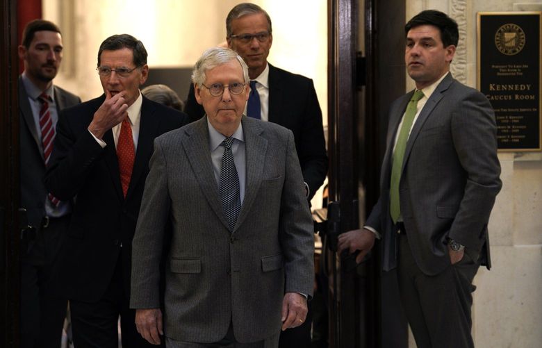 Senate Minority Leader Mitch McConnell (R-KY), with GOP senators, walks out toward the media after the Republican Weekly Policy Luncheon on Capitol Hill in Washington, D.C., on Tuesday, Feb. 15, 2022. (Yuri Gripas/Abaca Press/TNS) 40291231W 40291231W