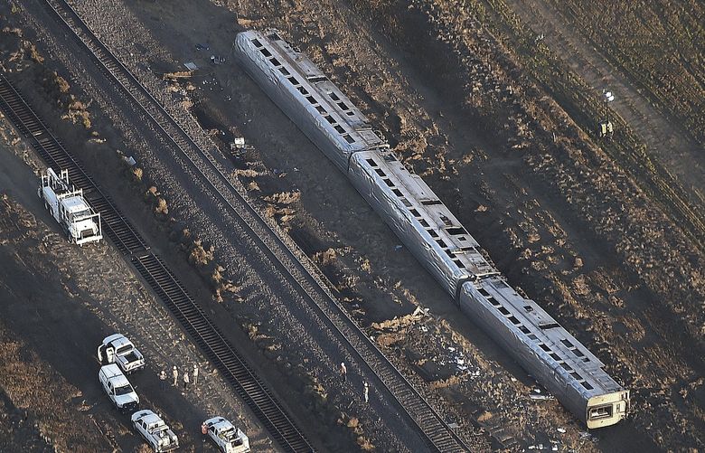 This aerial view taken Sunday, Sept. 26, 2021, shows part of an Amtrak train that derailed in north-central Montana Saturday that killed multiple people and left others hospitalized, officials said. The westbound Empire Builder was en route to Seattle from Chicago, with two locomotives and 10 cars, when it left the tracks about 4 p.m. Saturday. (Larry Mayer/The Billings Gazette via AP) MTBIL102 MTBIL102