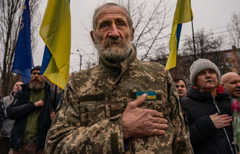 Valeriy Kocherga, 75, join other Ukrainians as they gather for the annual commemoration of the victims of the 2015 Kharkiv bombing in Kharkiv, Ukraine, on Feb. 22. MUST CREDIT: Washington Post photo by Salwan Georges.
