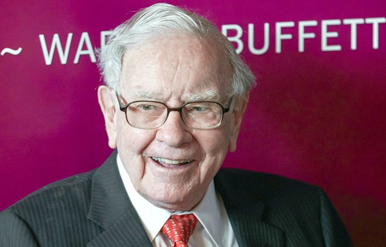 FILE – In this May 5, 2019, file photo Warren Buffett, Chairman and CEO of Berkshire Hathaway, smiles as he plays bridge following the annual Berkshire Hathaway shareholders meeting in Omaha, Neb. (AP Photo/Nati Harnik, File)