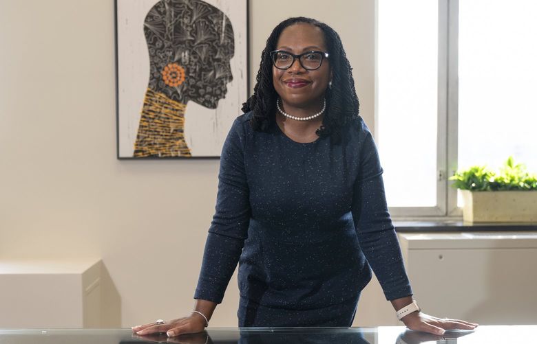 Judge Ketanji Brown Jackson, who is a U.S. Circuit Judge on the U.S. Court of Appeals for the District of Columbia Circuit, poses for a portrait, Friday, Feb., 18, 2022, in her office conference room at the court in Washington. President Joe Biden on Friday nominated federal appeals court Judge Ketanji Brown Jackson to the U.S. Supreme Court, making her the first Black woman selected to serve on a court that once declared her race unworthy of citizenship and endorsed segregation.  (AP Photo/Jacquelyn Martin) DCJM104 DCJM104