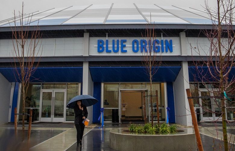 After a grand opening ceremony, a woman walks away from Blue Origin’s new Kent headquarters, the O’Neill building,  Monday, January 6, 2020.  After Blue Origin CEO Bob Smith and several politicians spoke, there was a ribbon cutting to commemorate the event.

 212584