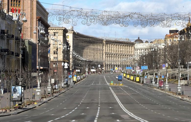 A view of Khreshchatyk, the main street, empty, due to curfew in the central of Kyiv, Ukraine, Sunday, Feb. 27, 2022. A Ukrainian official says street fighting has broken out in Ukraine’s second-largest city of Kharkiv. Russian troops also put increasing pressure on strategic ports in the country’s south following a wave of attacks on airfields and fuel facilities elsewhere that appeared to mark a new phase of Russia’s invasion. (AP Photo/Efrem Lukatsky) XAZ128 XAZ128