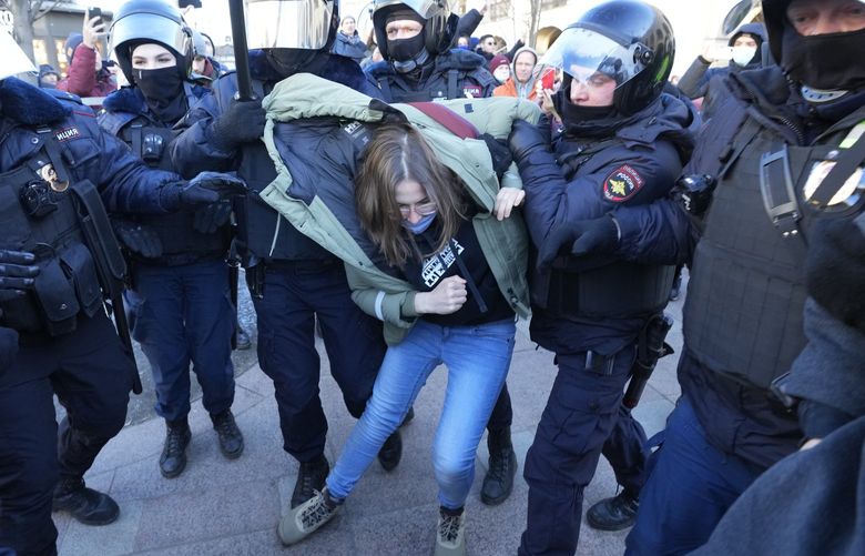 Police detain a demonstrator during an action against Russia’s attack on Ukraine in St. Petersburg, Russia, Sunday, Feb. 27, 2022. Protests against the Russian invasion of Ukraine resumed on Sunday, with people taking to the streets of Moscow and St. Petersburg and other Russian towns for the third straight day despite mass arrests. (AP Photo/Dmitri Lovetsky) XAZ148 XAZ148