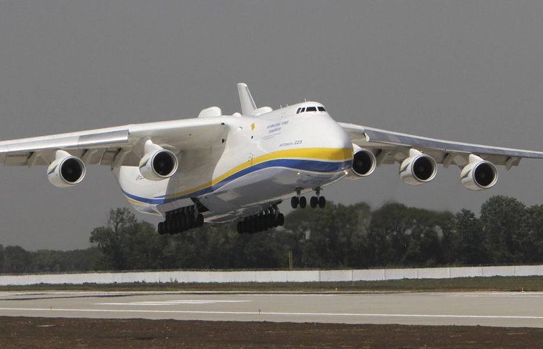 FILE – The Ukrainian Antonov-225 Mriya (Dream), the world’s heaviest and largest aircraft, makes a test landing at the new runway at the airport in Donetsk, Ukraine on July 26, 2011. Ukraine’s defense industry conglomerate says the world’s largest plane that was in regular operation was heavily damaged in fighting with Russian troops at the airport outside Kyiv where it was parked. (AP Photo/Sergey Vaganov, File) TKMY101 TKMY101