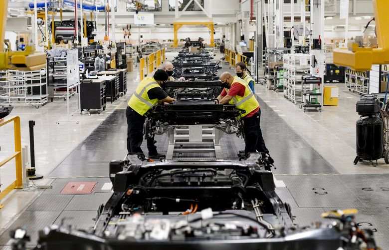 FILE — An assembly line for Rivian’s R1T electric truck in Normal, Ill., Jan. 13, 2020. Rivian, a promising and well-funded electric truck maker, said on Friday that it was planning to sell shares through an initial public offering. (Lyndon French/The New York Times) XNYT73