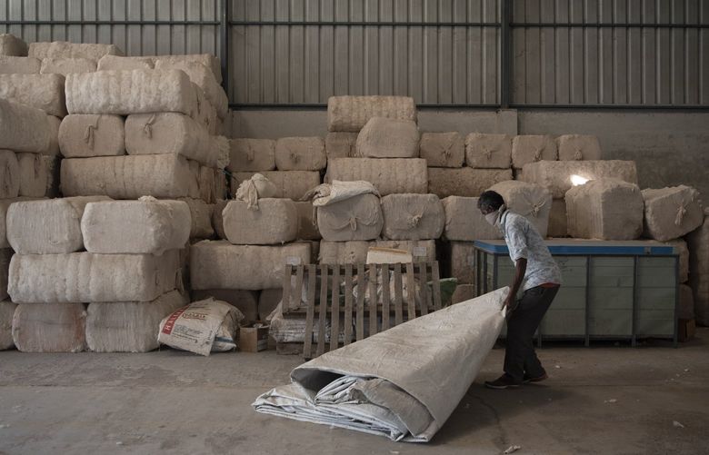 Bales of cotton at a ginning mill run by bioRe, which was formed by two Swiss companies, in Kasrawad, India, Oct. 22, 2021. The organic cotton movement in India appears to be booming, but much of this growth is fake, say those who source, process and grow the cotton. (Saumya Khandelwal/The New York Times)   
 XNYT154 XNYT154