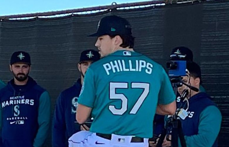 Connor Phillips, a young pitching prospect in the Mariners organization, delivers a pitch Thursday morning during a bullpen session at the team’s complex in Peoria, Ariz. Phillips is one of about 60 Mariners minor leaguers participating in a mini-camp.