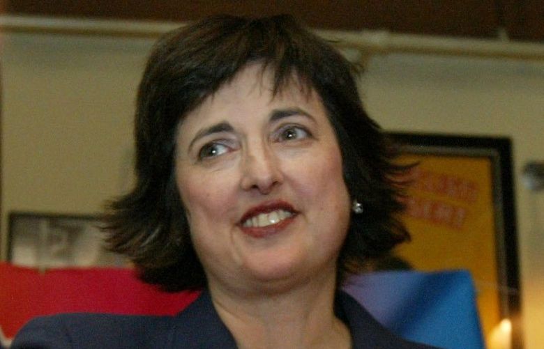 As the evening heads past 11 p.m., and the race too close to call, Democratic attorney general candidate Deborah Senn comes back to the podium to rethank supporters on primary election night , Tuesday, Sept. 14, 2004, in Seattle. To her right is husband Rudi Bertschi (CQ). (Photo by Ken Lambert / The Seattle Times)