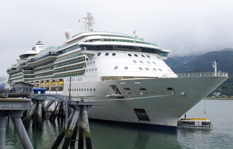 The Royal Caribbean cruise ship Serenade of the Seas is docked in Juneau, Alaska, on Friday, July 23, 2021. The ship is the first to arrive this season. During a typical year, it’s common for several ships to be in port in Juneau at the same time. But no large ships came to Alaska last year amid the pandemic, and Congress stepped in to help salvage a cruise season for Alaska this year. Alaska Lt. Gov. Kevin Meyer was among those who greeted the ship. (AP Photo/Becky Bohrer) FX503