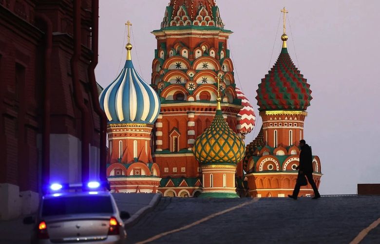 A police car patrols near to Saint Basil’s Cathedral on Red square in Moscow, Russia, on Thursday, Feb. 24, 2022. Russian forces attacked targets across Ukraine after President Vladimir Putin ordered an operation to “demilitarize” the country, prompting international condemnation and threats of further punishing sanctions on Moscow, sending markets tumbling worldwide. (Bloomberg)