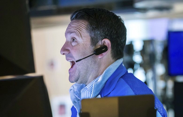 In this photo provided by the New York Stock Exchange, trader Leon Montana works on the trading floor, Thursday, Feb. 24, 2022. Markets shuddered worldwide Thursday and swung sharply after Russia’s invasion of Ukraine threatened to push the high inflation squeezing the global economy even higher. (Courtney Crow/New York Stock Exchange via AP) RDNY417 RDNY417