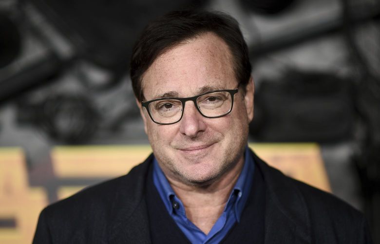 FILE – Bob Saget arrives at a screening of “MacGruber” on Dec. 8, 2021, in Los Angeles. Saget’s family has released a statement on the cause of his death last month in Florida, citing authorities saying the actor-comedian died from an accidental blow to the head. (Photo by Richard Shotwell/Invision/AP, File) CAPM303 CAPM303