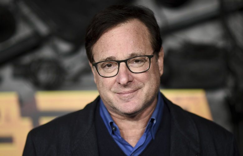 FILE – Bob Saget arrives at a screening of “MacGruber” on Dec. 8, 2021, in Los Angeles. Saget’s family has released a statement on the cause of his death last month in Florida, citing authorities saying the actor-comedian died from an accidental blow to the head. (Photo by Richard Shotwell/Invision/AP, File) CAPM303 CAPM303