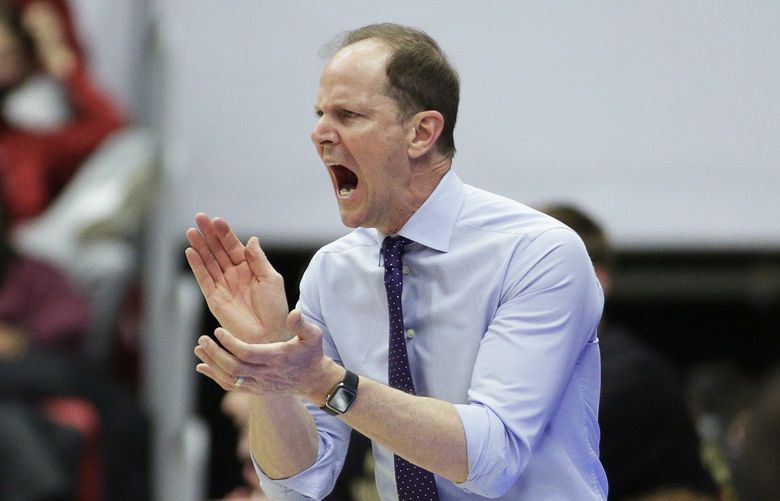 Washington coach Mike Hopkins applauds during the second half of the team’s NCAA college basketball game against Washington State, Wednesday, Feb. 23, 2022, in Pullman, Wash. Washington State won 78-70. (AP Photo/Young Kwak)