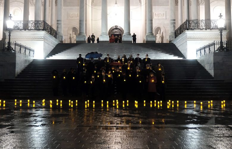 Members of the House and Senate gather on Monday, Feb. 7, 2022, for a moment of silence to remember the 900,000 people who have died from COVID-19 in the United States. The balance of recent surveys suggests that the desire to return to normalcy has approached or even overtaken alarm about the coronavirus itself. (Michael A. McCoy/The New York Times) XNYT136 XNYT136