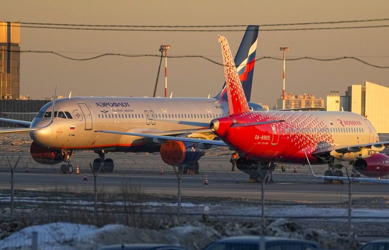 Aeroflot’s passengers planes are parked at Sheremetyevo airport, outside Moscow, Russia, Tuesday, March 1, 2022. Russia’s largest airline, Aeroflot, said Monday that it suspended flights to New York, Washington, Miami and Los Angeles through Wednesday because Canada has closed its airspace to Russian planes. On Sunday, the European Union and Canada announced they were closing their airspace to Russian airlines and private planes owned by wealthy Russians. (AP Photo/Pavel Golovkin) XAZ159