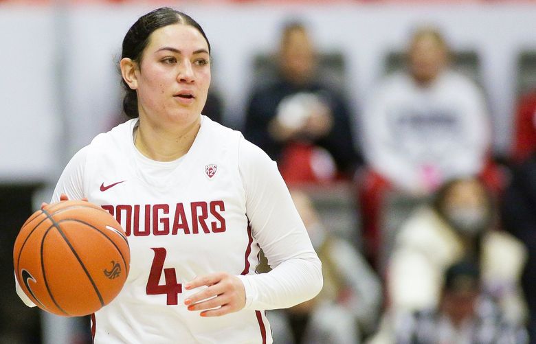 Washington State guard Krystal Leger-Walker controls the ball during the second half of an NCAA college basketball game against Stanford, Sunday, Jan. 2, 2022, in Pullman, Wash. (AP Photo/Young Kwak) OTK