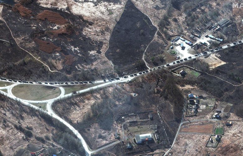 This satellite image provided by Maxar Technologies shows a military convoy near Invankiv, Ukraine Monday, Feb. 28, 2022. (Satellite image Â©2022 Maxar Technologies via AP) TH802 TH802