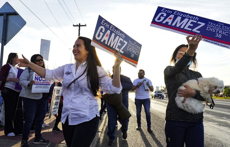 Texas State Representative for District 38 Democratic candidate Erin Elizabeth Gamez is pictured Tuesday, March 1, 2022, campaigning on election day for the 2022 Democratic Primary Election outside the polling location at Burns Elementary in Brownsville, Texas. (Denise Cathey/The Brownsville Herald via AP) TXBRH102 TXBRH102