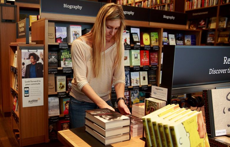 Amazon’s Annie Zamojski works inside the company’s first brick-and-mortar bookstore, in Seattle Monday, Nov. 2, 2015. The store will open tomorrow Tuesday, Nov. 3, 2015 in Seattle’s University District.
