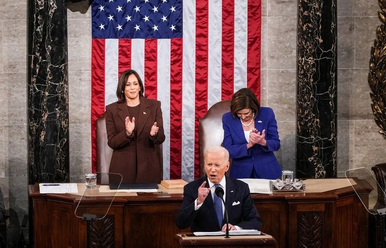 President Joe Biden delivers his State of the Union address to a joint session of Congress at the Capitol in Washington, March 1, 2022, as Vice President Kamala Harris stands with House speaker Nancy Pelosi (D-Calif.) look on. (Sarahbeth Maney/The New York Times) XNYT323 XNYT323