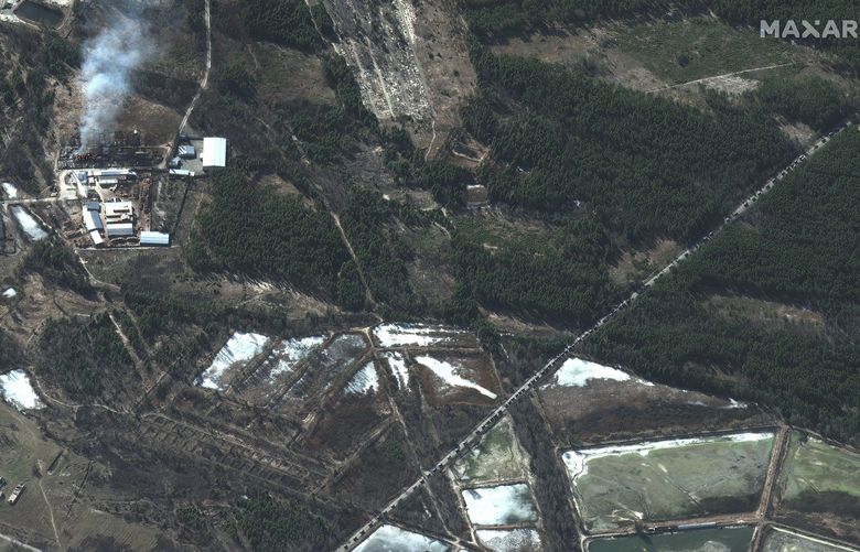 In a satellite image provided by Maxar Technologies, building fires and a Russian military convoy along a highway north of Ivankiv, Ukraine, Feb. 28, 2022. Russian operations in northern Ukraine appeared to be stalled for a third day as the Kremlin sent more troops into the country, a senior U.S. defense official said Thursday morning, adding that Ukrainian forces may be attacking a convoy of Russian forces attempting to take the major northern cities of Kyiv, Chernihiv and Kharkiv. (Satellite image ©2022 Maxar Technologies via The New York Times) – NO SALES, EDITORIAL USE ONLY, MAXAR WATERMARK MUST NOT BE CROPPED OUT  XNYT86 XNYT86