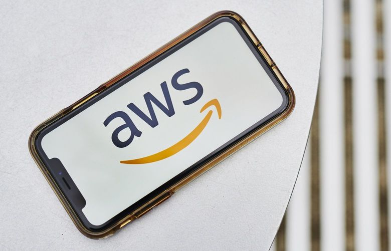 The logo for Amazon Web Services Inc., a subsidiary of Amazon.com Inc., is displayed on an Apple Inc. iPhone in an arranged photograph taken in the Brooklyn Borough of New York, U.S., on Monday, Jan. 27, 2020. Amazon.com Inc. is scheduled to release earnings figures on January 30. Photographer: Gabby Jones/Bloomberg