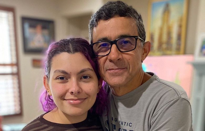 In this handout photo provided by Maria Elena, Gustavo Cardenas, one of six oil executives jailed in Venezuela, poses for a photo with his daughter Maria Mercedes, in their home in Houston, Wednesday, March 9, 2022. Cardenas expressed happiness to be home after an imprisonment of more than four years that he said â€œhas caused a lot of suffering and pain, much more than I can explain with my words.â€ But he said he is praying for five colleagues of his company who were not released Tuesday night. Together, the men are known as the â€œCitgo 6.â€ (Maria Elena Cardenas via AP) XLAT110 XLAT110