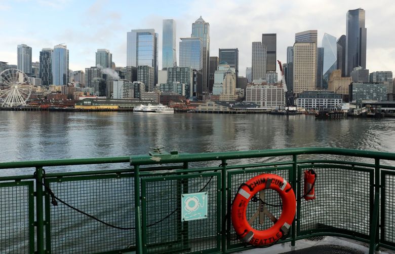 LO The Seattle skyline as the ferry Chimacum on the Seattle-to-Bremerton run leaves the Colman Dock on Thursday January 13, 2022 219318