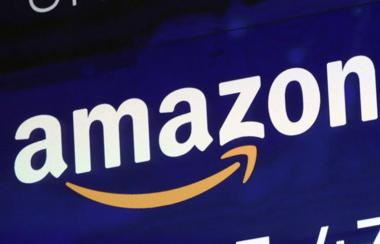 FILE – The logo for Amazon.com Inc. is displayed on a screen at the Nasdaq MarketSite, July 27, 2018.   (AP Photo/Richard Drew, file) 