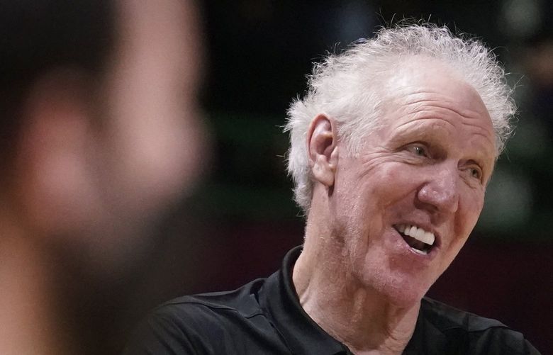 Basketball Hall of Fame legend Bill Walton, left, jokes with Denver Nuggets center Nikola Jokic during a practice session for the NBA All-Star basketball game in Cleveland, Saturday, Feb. 19, 2022. (AP Photo/Charles Krupa) OHCK105 OHCK105