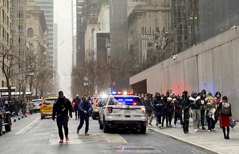 In this photo from a social media post by Scott Cowdrey, people are evacuated from the Museum of Modern Art where a stabbing occurred, Saturday, March 12, 2022, in New York. Police said two people were stabbed inside MoMA and in stable condition at Bellevue Hospital. (Scott Cowdrey via AP) BMNY501 BMNY501