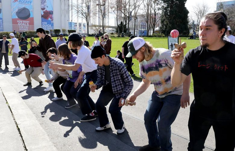 Participants attempt kendama tricks demonstrated from the Mural Amphitheatre stage at Seattle Center. It’s is a Japanese hand-eye coordination game using a wooden cup-and-ball connected by string.  It’s challenging to master tricks and world championships are in Japan.


LO Kendama amateur competition at Seattle Center on March 12, 2022 219846