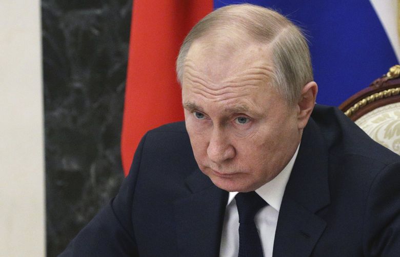 FILE – Russian President Vladimir Putin chairs a meeting with members of the government via teleconference in Moscow, Thursday, March 10, 2022. (Mikhail Klimentyev, Sputnik, Kremlin Pool Photo via AP, File) WX201 WX201