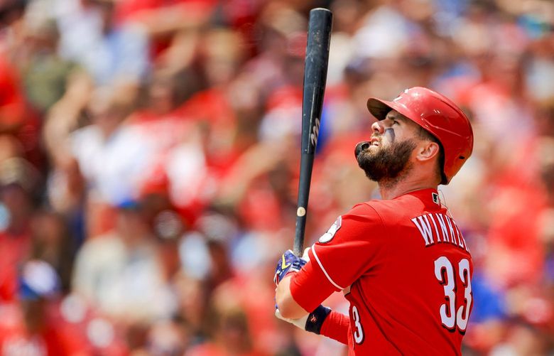 Cincinnati Reds’ Jesse Winker bats during a baseball game against the Chicago Cubs in Cincinnati, July 4, 2021. OHAD