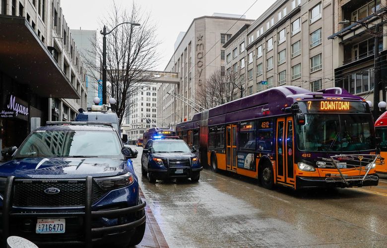 3rd Ave downtown Seattle – Amazon and others moving away from the area – 031422

Two Seattle Police Department vehicles and a mobile precinct van idle along 3rd Ave between Pike and Pine as busses pass by Monday, March 14, 2022 in downtown Seattle, Wash. 219860