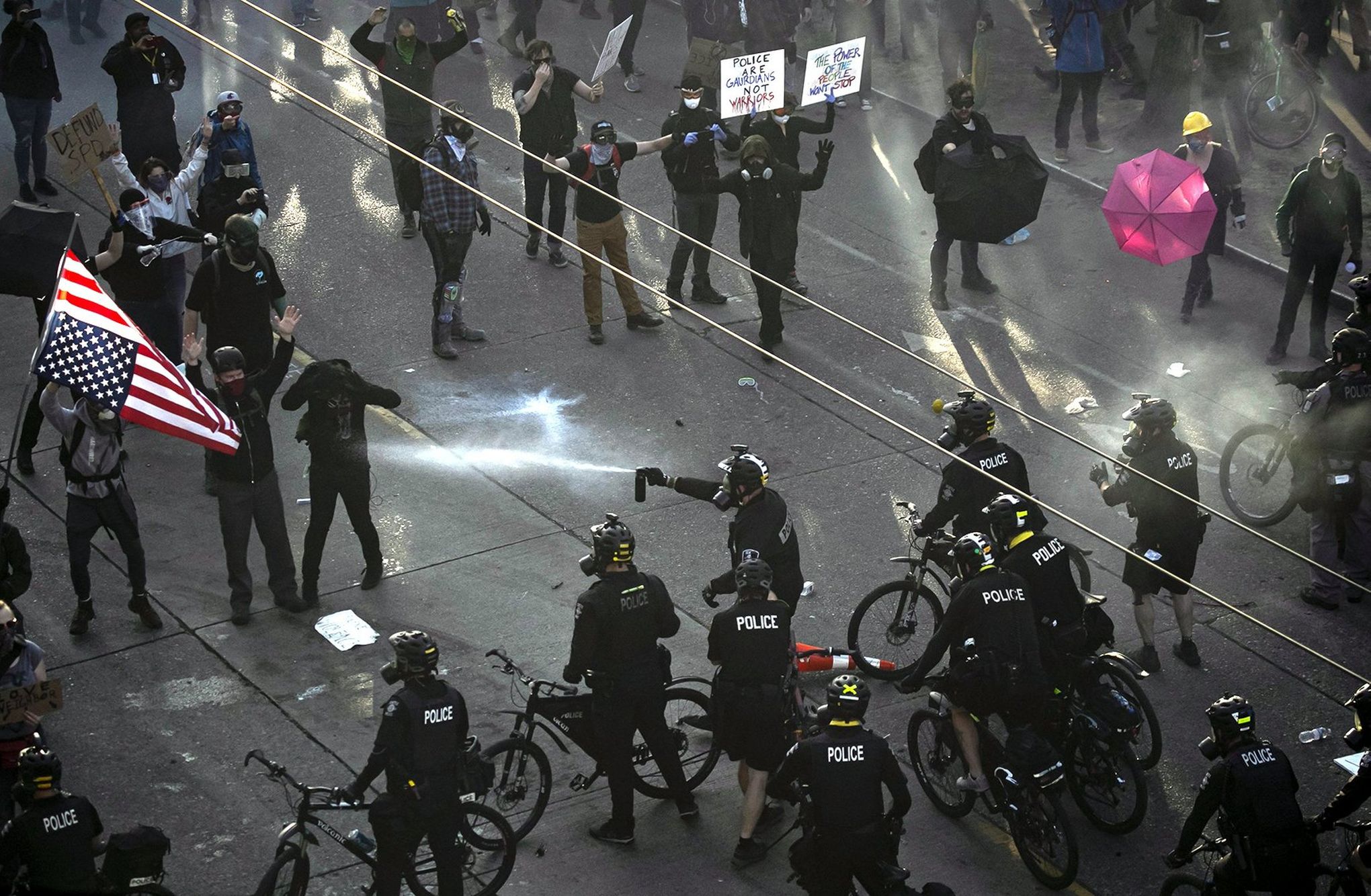 Seattle police clear protesters at 11th and Pine near Cal Anderson Park