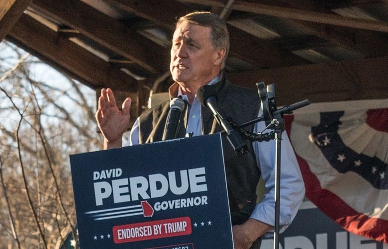 Former Republiucan senator and current gubernatorial candidate David Perdue speaks at a rally on March 1, 2022 in Rutledge, Ga., against a proposed Rivian electric truck assembly plant. In recent months, the project has gotten tangled in the kind of partisan politics that is pulsing through many aspects of American life.  (Matthew Odom/The New York Times) XNYT8 XNYT8