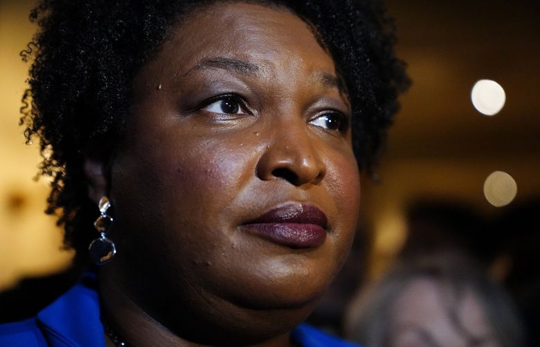 Georgia gubernatorial Democratic candidate Stacey Abrams talks to the media after qualifying for the 2022 election on Tuesday, March 8, 2022, in Atlanta. Abrams has no announced opposition for governor for the Democratic nomination. (AP Photo/Brynn Anderson) GABA110 GABA110