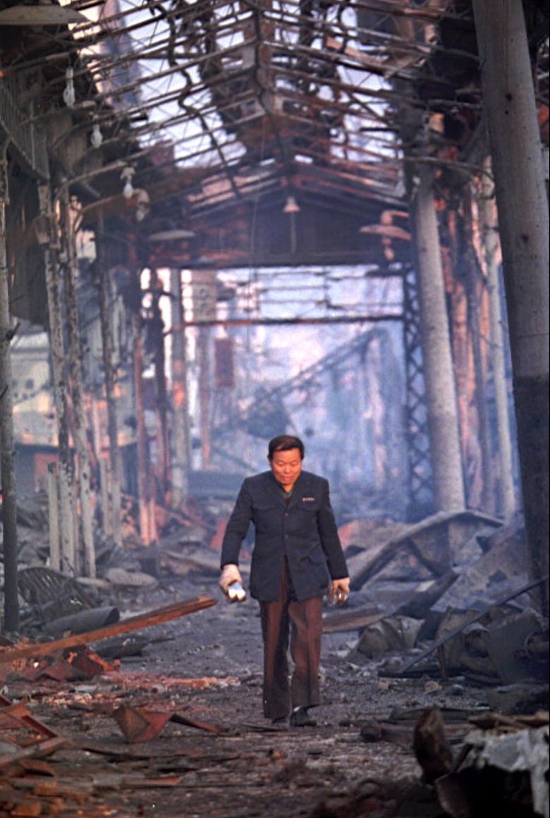 A lone man walks through a gutted shopping mall in Kobe, Japan, a day after a devastating earthquake hit the city. (The Associated Press, 1995) 
