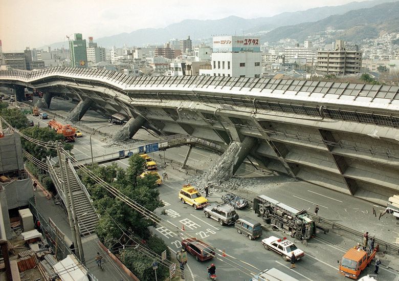 Police and firefighters survey the extensive damage of the collapsed Kobe-Osaka highway in Kobe, Japan, in 1995 after a magnitude-6.9 earthquake. The quake’s epicenter was 12.5 miles from Kobe, and 10 miles beneath the surface. (Atsushi Tsukada / The Associated Press, 1995)